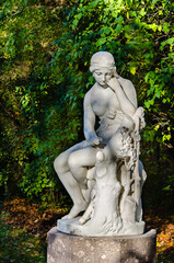 Fototapeta na wymiar The marble statue of the Italian sculptor R. Rinaldi - Erminia is installed on the Aviary site of Pavlovsky Park.