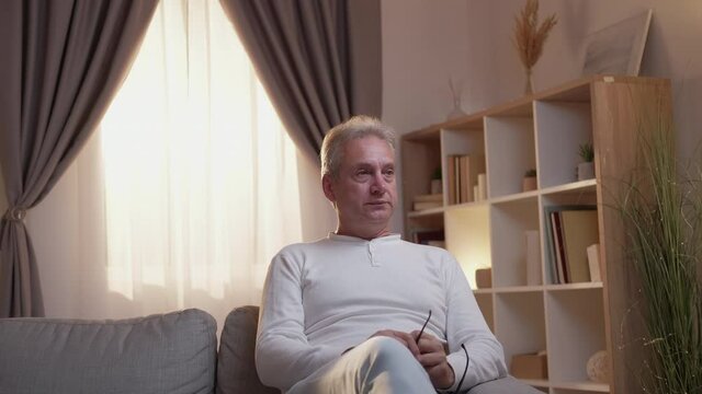 Supportive son. Family care. Bonding relationship. Caring loving teenager feeling sorry cheering up sad depressed father at home living room.