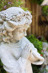 Close up view of a sculpture angel in garden