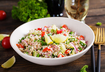 Tabbouleh salad. Traditional middle eastern or arab dish. Levantine vegetarian salad with parsley, cucumber, couscous, tomato.