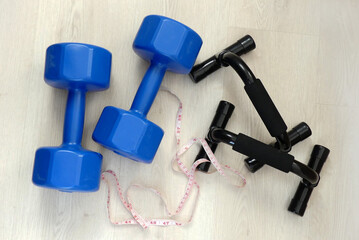losing weight and losing weight, measuring tape in the same frame, 5 kg double hand dumbbells and...