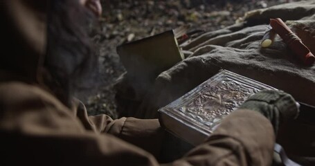 Crop wiseman opening old book