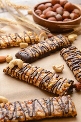 Tasty chocolate nut bars on parchment