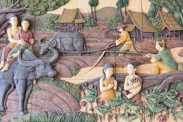 Thai rural life style stone carving