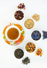 Obraz na płótnie Canvas Natural herbal tea of different varieties. Variety of dry tea in utensils, close up.
