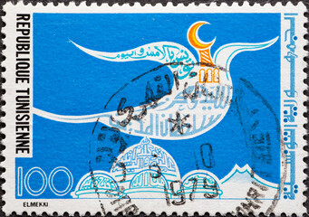 Tunisia - circa 1978 : a postage stamp from Tunisia shows a Dove over cupolas of Marabout Sidi...
