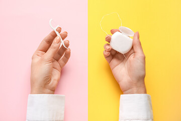 Woman with dental floss and toothpick on color background - obrazy, fototapety, plakaty