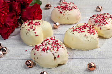 Handmade gingerbread in white chocolate on a light background. Festive packaging.