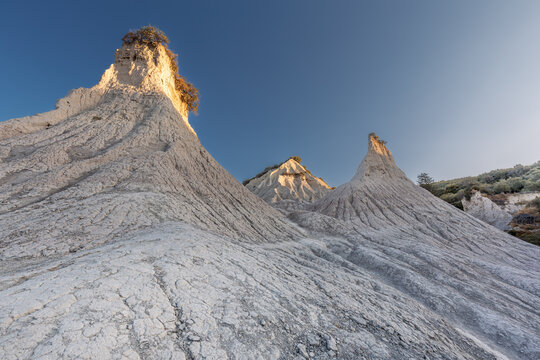 Bizzare-looking conical hills eroded by winds and rains consisting of grey clay, Komolithi, Greece