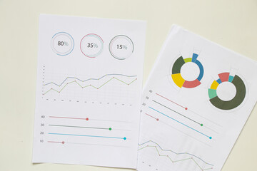 reports and histograms on paper on the table, analytics and statistics on paper, business