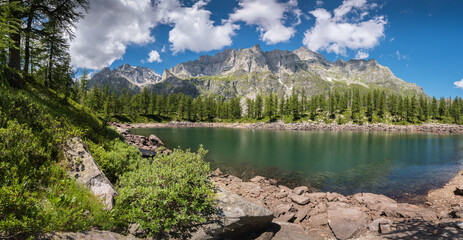 Lago Nero alpine lake at Alpe Devero Italy with trees amd rocks