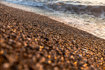 marine shiny stones on the seashore