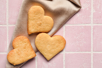 Tasty heart shaped cookies on tile background. Valentines Day celebration