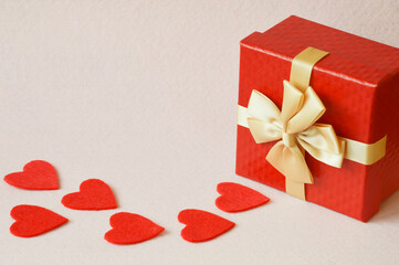 Happy Valentine's Day. background for the design of a romantic holiday. Love. gift box and red...