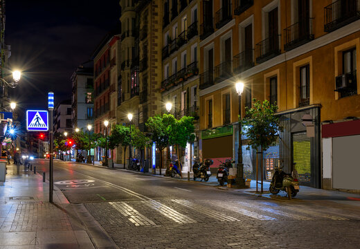 Fototapeta Calle Mayor is old street in Madrid, Spain. Architecture and landmark of Madrid. Night cityscape of Madrid.