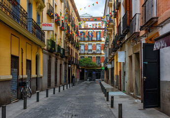 Fototapeta na wymiar Old street in Madrid, Spain. Architecture and landmark of Madrid, postcard of Madrid.