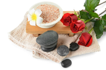Obraz na płótnie Canvas Spa stones, sea salt, roses and towel isolated on white background. Valentine's Day celebration