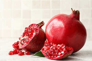 Ripe delicious pomegranate on light background