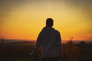 silhouette of a person in the sunset