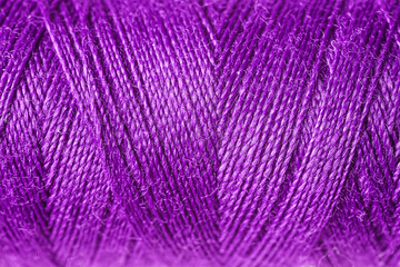 Purple sewing threads as background