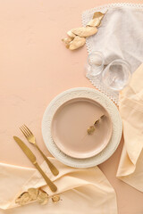 Beautiful table setting on beige background