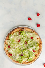 Delicious pizza Caesar with chicken, parmesan, egg, cherry tomatoes and fresh lettuce. banner, menu, recipe place for text, top view