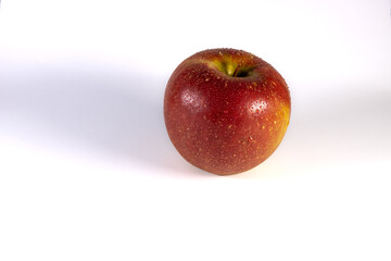 A red apple on a white background exposed