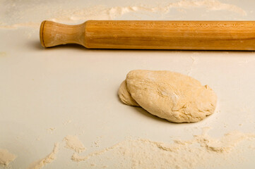 Dough and rolling pin with flour. Handmade, food