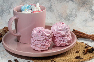 Marshmallow in the form of handmade animals on a light background. In a cup of coffee. Women's Day, Valentine's Day.