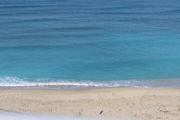 Tranquil scenery. Blue sea water, sand, no people. Beautiful day on a beach.