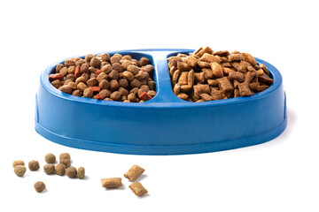Dry cat food in an iron bowl on a white background