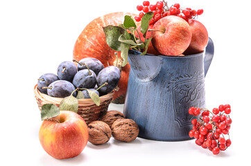 apples in a garden jug and other fruits