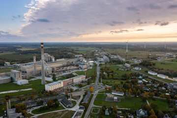 An aerial drone view of the industrial city in the Baltic. Plant for the production of concrete. Wind park.