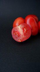 tomatoes on a black background