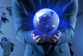 Businessman holding globe in global business concept