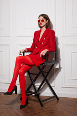 Fashion asian female model in red jacket and skirt. - obrazy, fototapety, plakaty