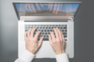 Searching internet. Online website search engine selective focus. Blured hands using computer for...