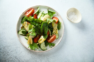 Artichoke salad with tomatoes and cucumber