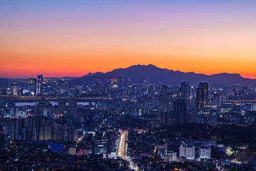 Cityscape night view of Seoul, South Korea at sunset time