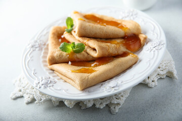 Homemade crepes with apricot jam