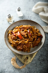 Homemade rice noodles with meat and vegetables