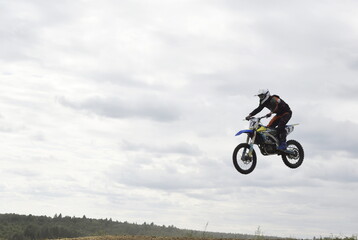 Fototapeta na wymiar motocross rider in action, biker