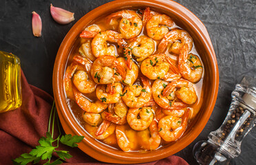Traditional spanish shrimp with garlic and parsley, top view