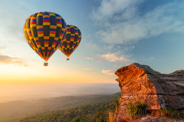Hot air balloons with landscape mountain,Beautiful colorful hot air balloons flying over mountain at view point Sunset of travel place, Doi inthanon, Chiang mai's Hidden Paradise in Thailand.