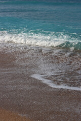 Fototapeta na wymiar Clear blue sea water close up photo. Calm sea, blue sky, tranquil scene. Warm day on the beach. 