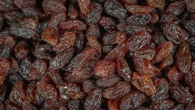 Many raisins at rotating background - looping video