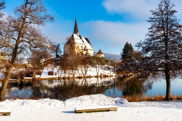 Idyllic view of the pilgrimage church and in Maria Worth in winter, Carinthia, Austria