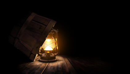 Lighted lamp under a bushel basket. Biblical parable theme concept.