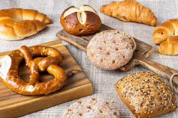 Various types of bread, buttery croissants, breads, rolls, baguettes, Fresh baked goods