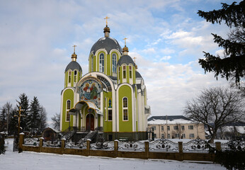 Beautiful old church on a background of winter nature in good weather